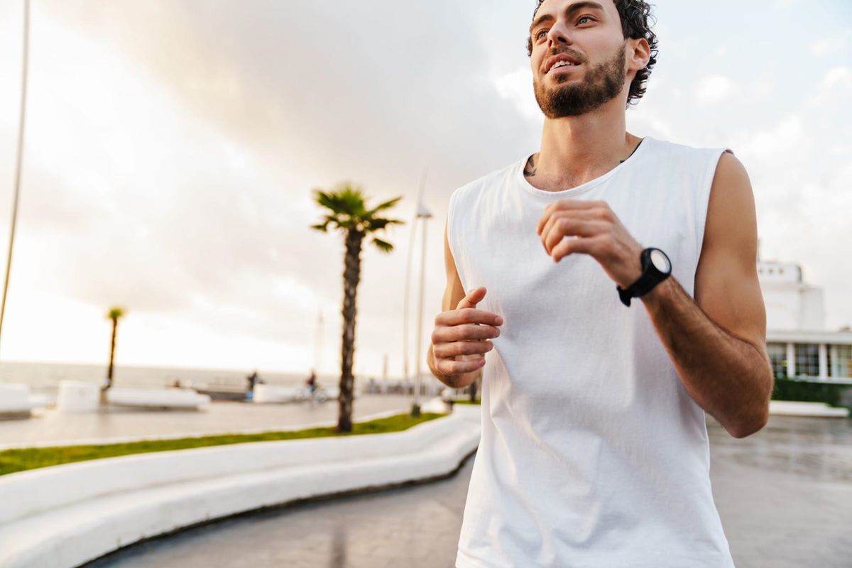 Man jogging outdoors in the early morning to stay active before the day's heat, supporting healthy routines during addiction recovery.